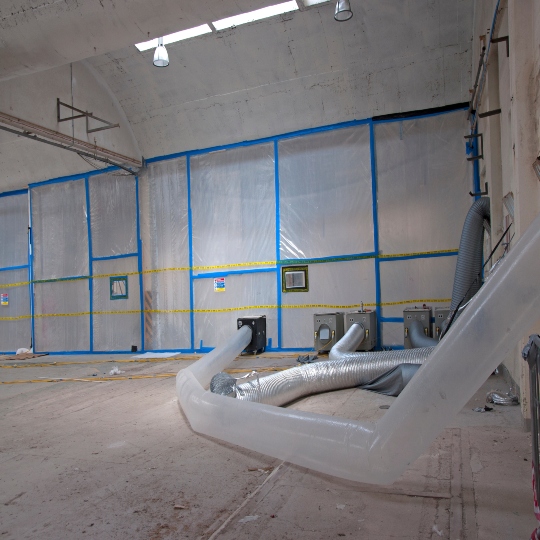 A room inside of a commercial building undergoing the asbestos removal process. 