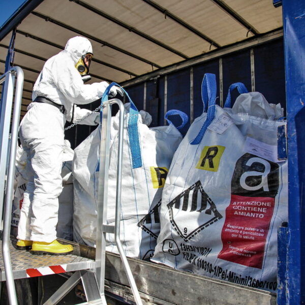 man removing asbestos waste
