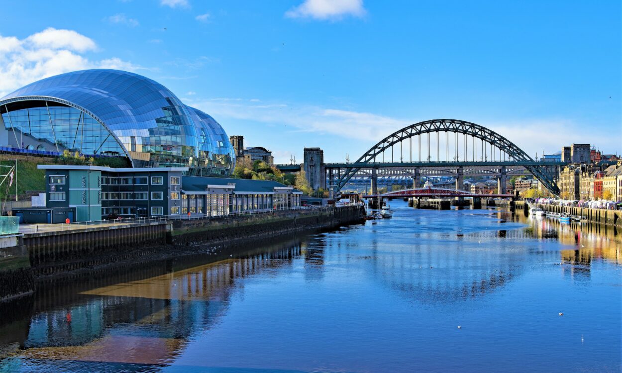 The River Tyne with the Sage, Tyne Bridge and surrounding buildings.