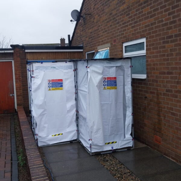 Entrance points to a building undergoing asbestos removal, ensuring worker safety and convenience.