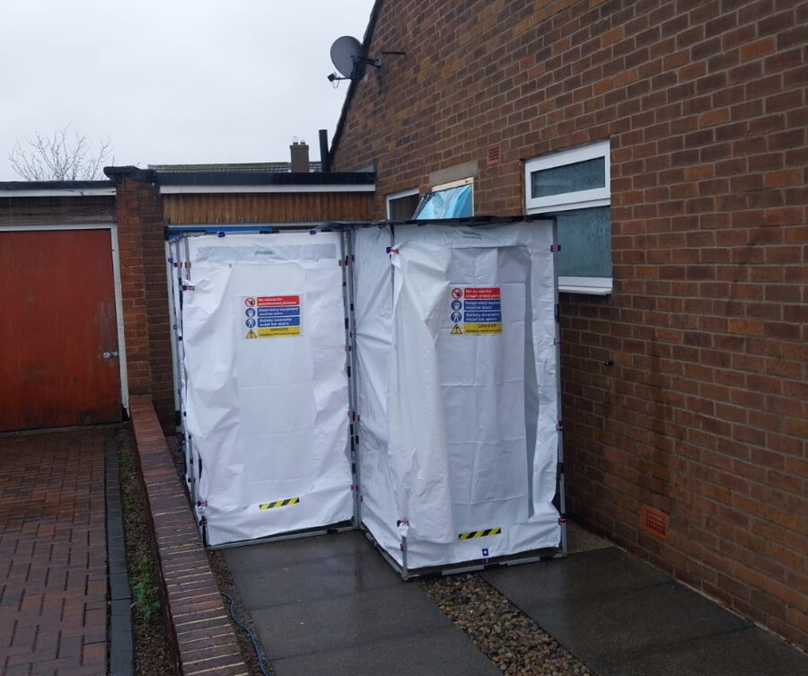 Entrance points to a building undergoing asbestos removal, ensuring worker safety and convenience.