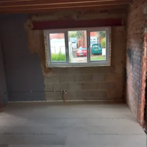 Garage space after the successful removal of the asbestos and enclosure sheeting, allowing renovation works to continue safely.